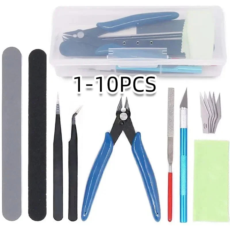 Everything in the kit laid out โ side cutter, tweezers, hobby knife, files and sanding sticks